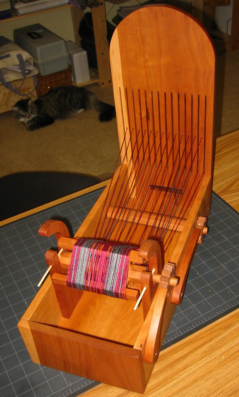 My dad helped me build this awesome inkle loom! I'm new to weaving